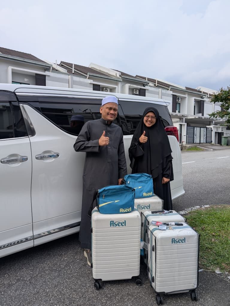 Travellers boarding a premium MPV